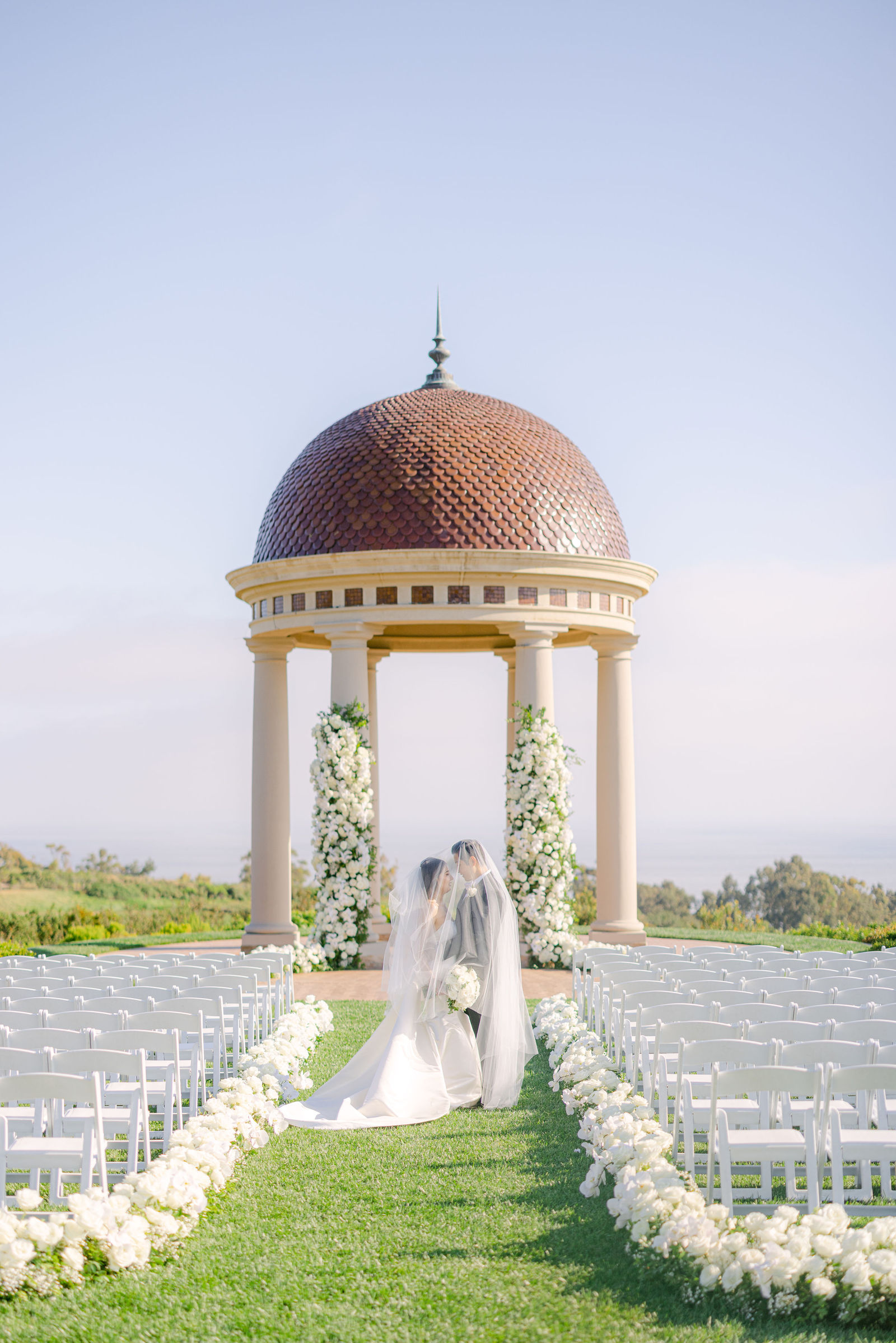 Walking the petal lined aisle to the rotunda
