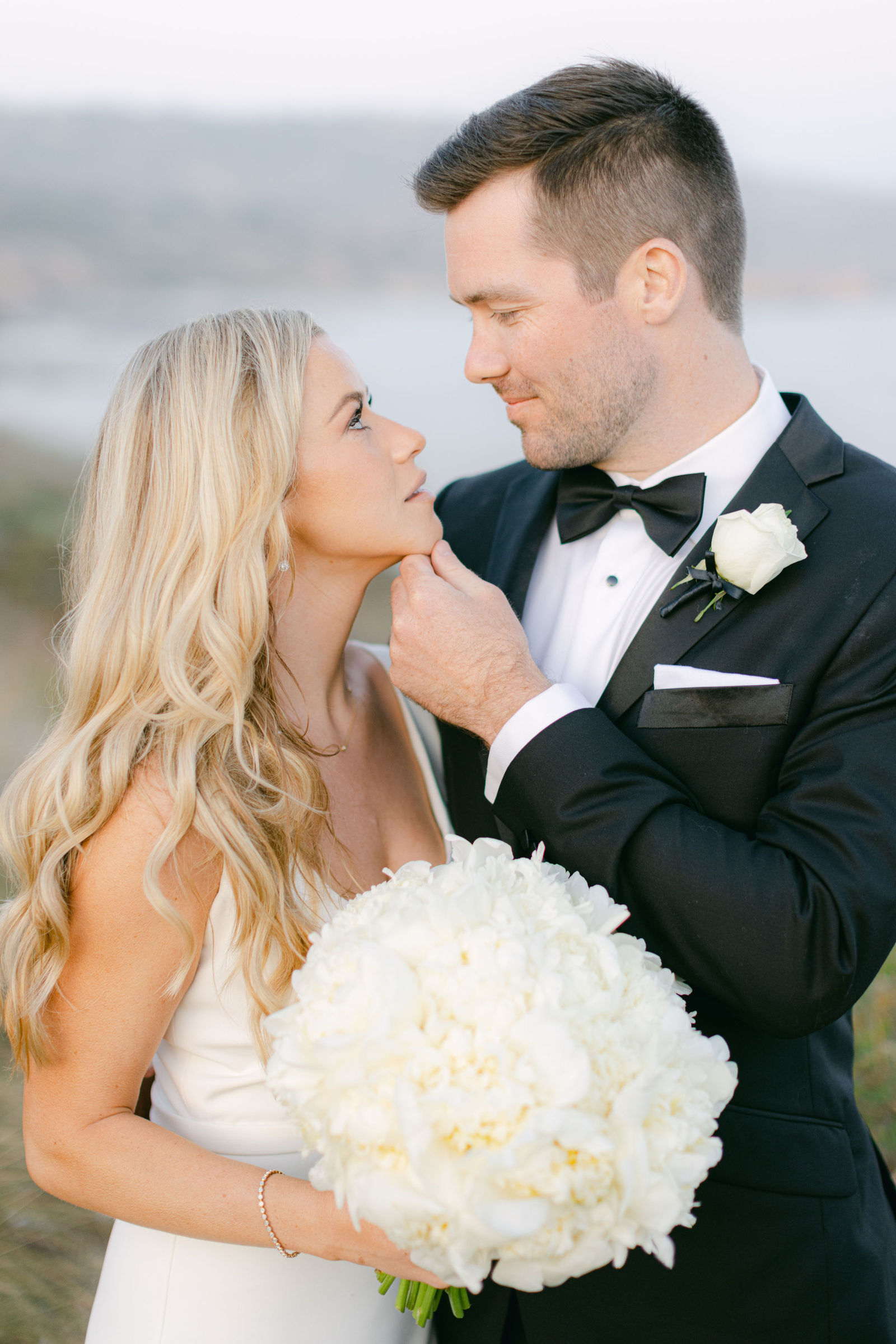 On the bluff with a bouquet of white peonies