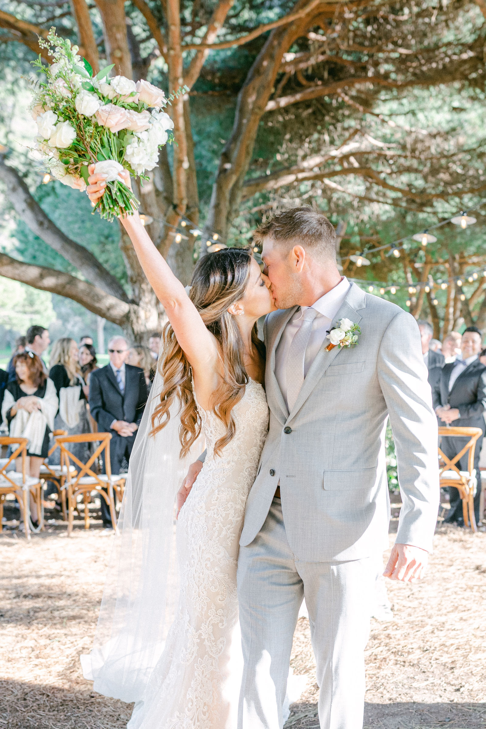 The recessional, arms up, guests on their feet