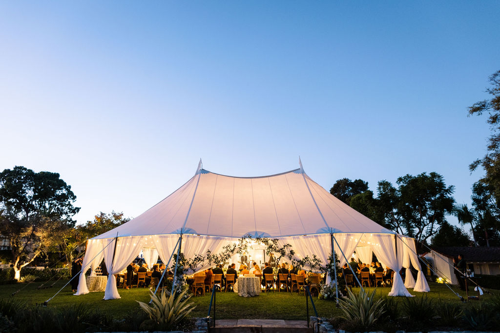 The sailcloth tent glowing at dusk on the Croquet Lawn at the Inn at Rancho Santa Fe