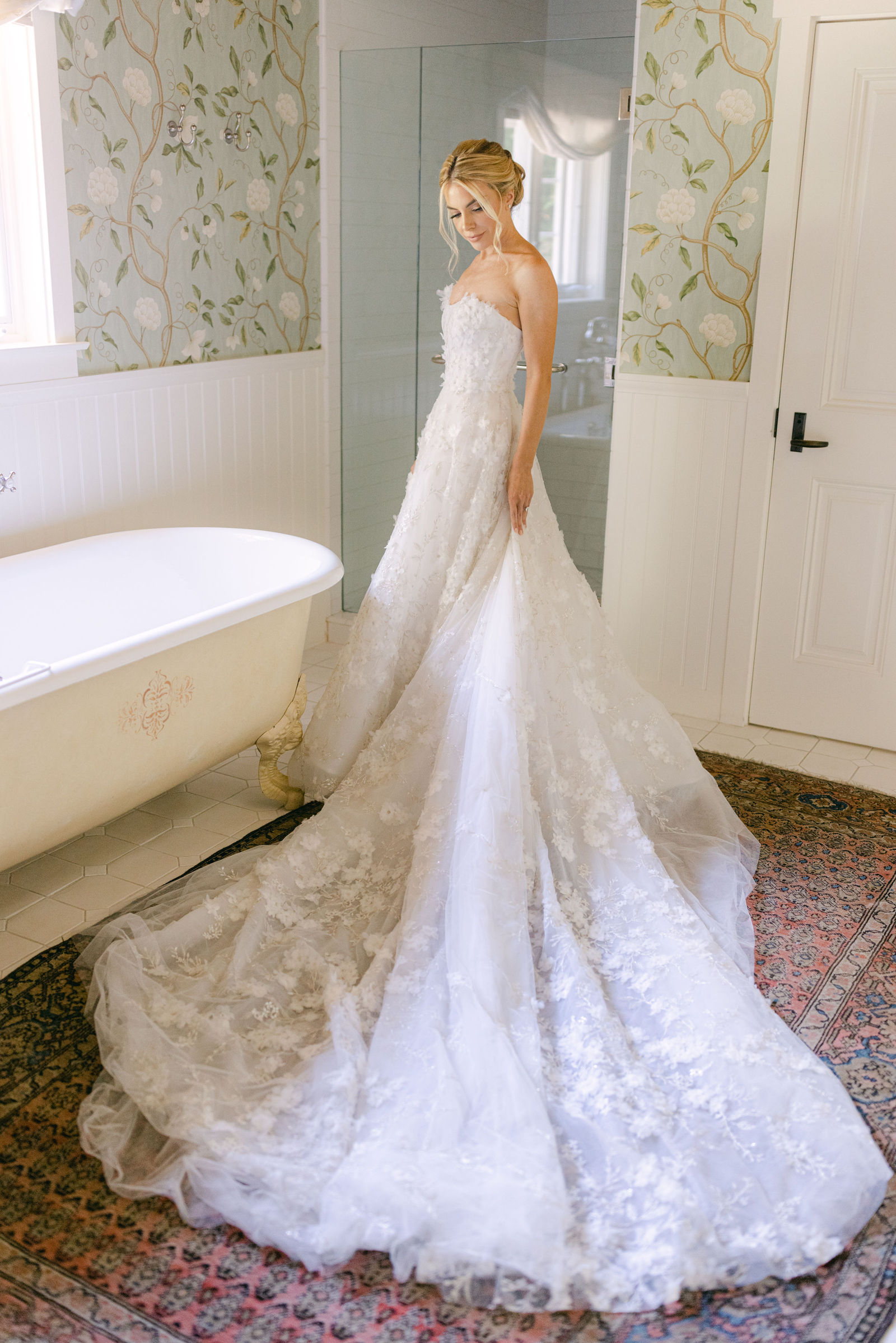 The gown, petals of lace, beside the clawfoot tub